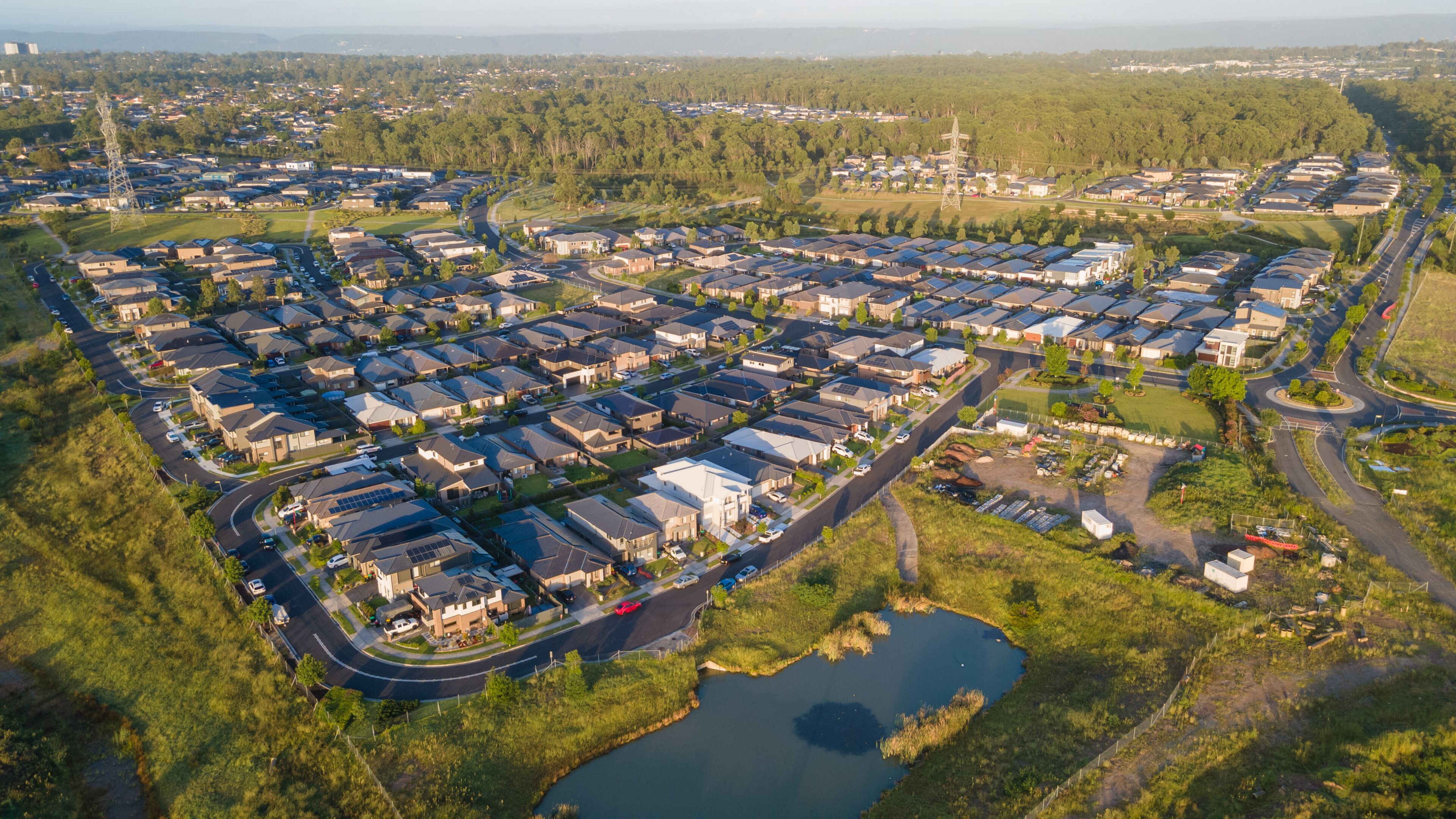 Aerial drone view of Jordan Springs East, known as the sinking suburb, in western Sydney, NSW Australia on a sunny morning in February 2024