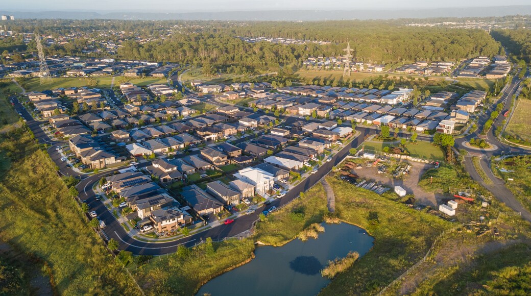 Aerial drone view of Jordan Springs East, known as the sinking suburb, in western Sydney, NSW Australia on a sunny morning in February 2024