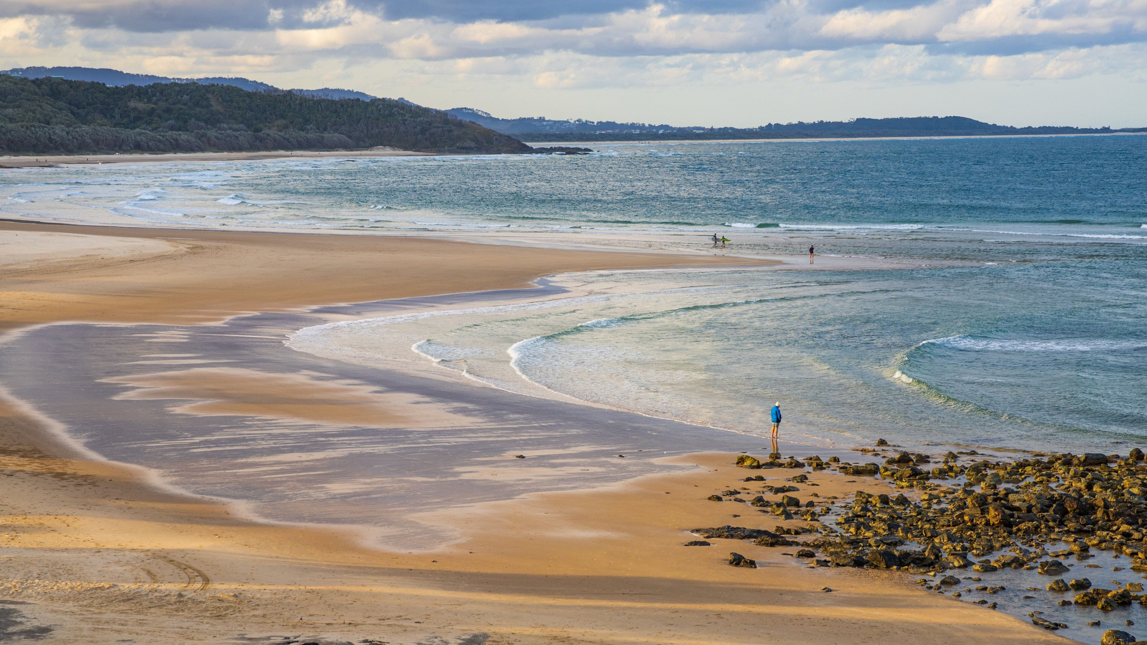Sawtell which includes a sandy beach and general coastal views