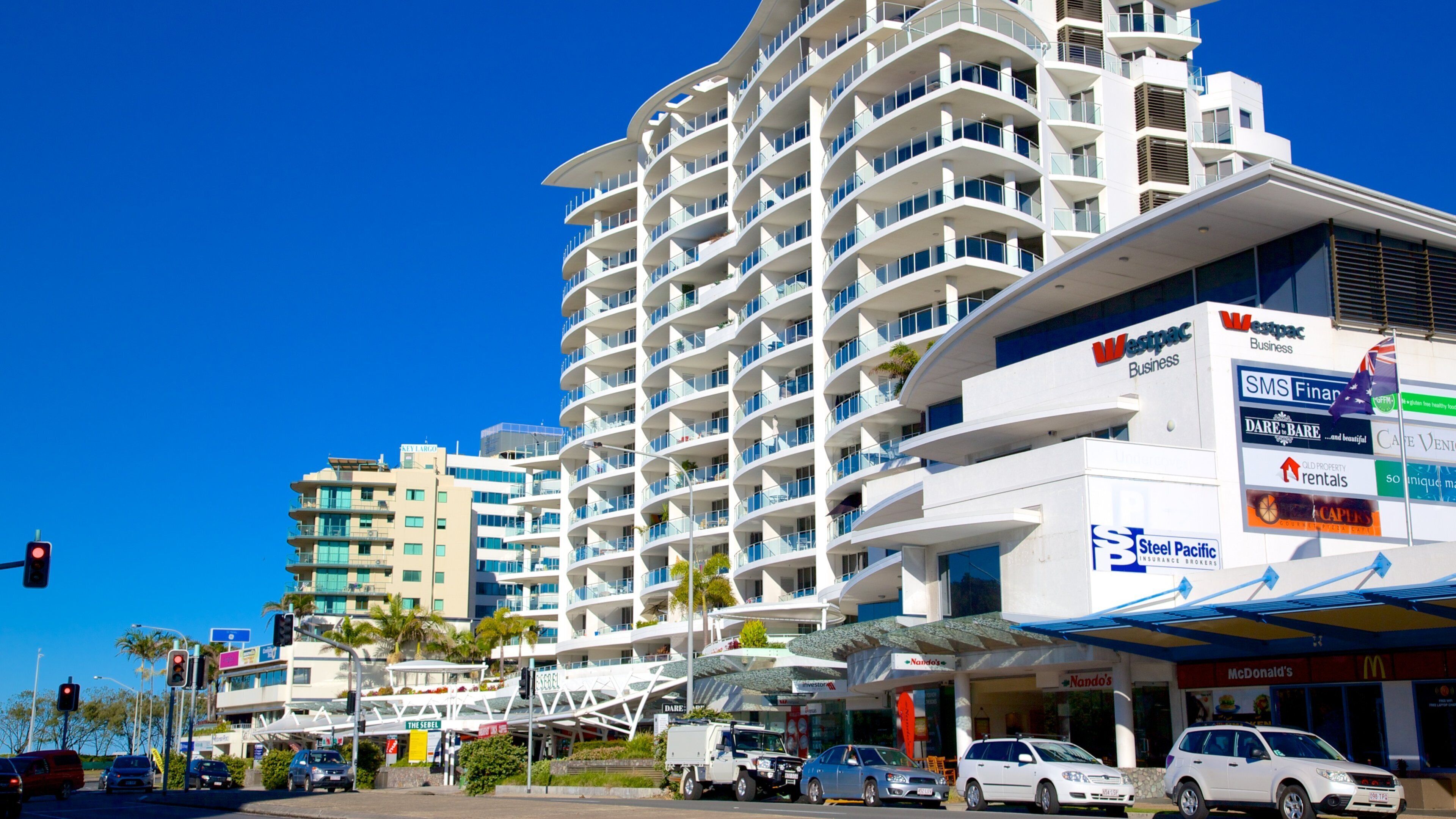 Alexandra Headland featuring signage and street scenes