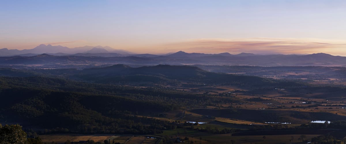 Panorama taken from Mount Tamborine looking down on Beaudesert rural landscape and mountain range in the background
