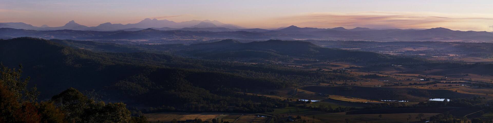 Panorama taken from Mount Tamborine looking down on Beaudesert rural landscape and mountain range in the background
