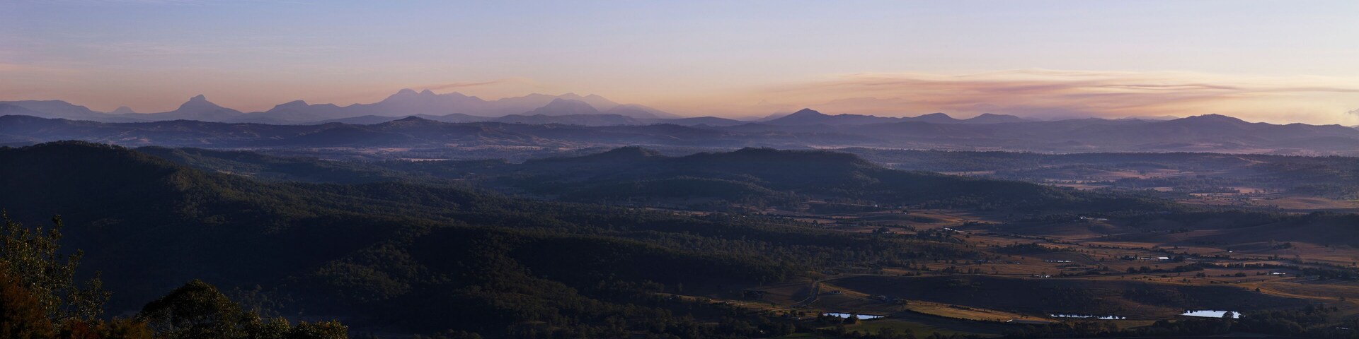 Panorama taken from Mount Tamborine looking down on Beaudesert rural landscape and mountain range in the background