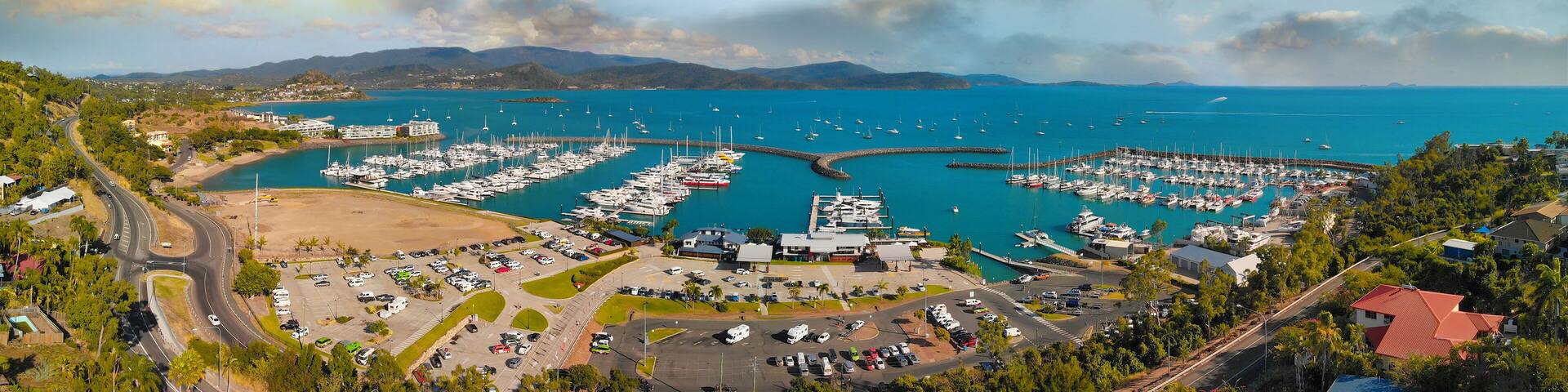 Panoramic aerial view of Airlie Beach skyline and Marina, Australia