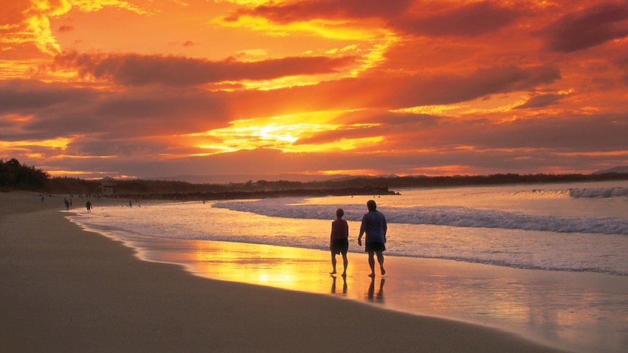 Noosa Heads showing a sandy beach and a sunset as well as a couple