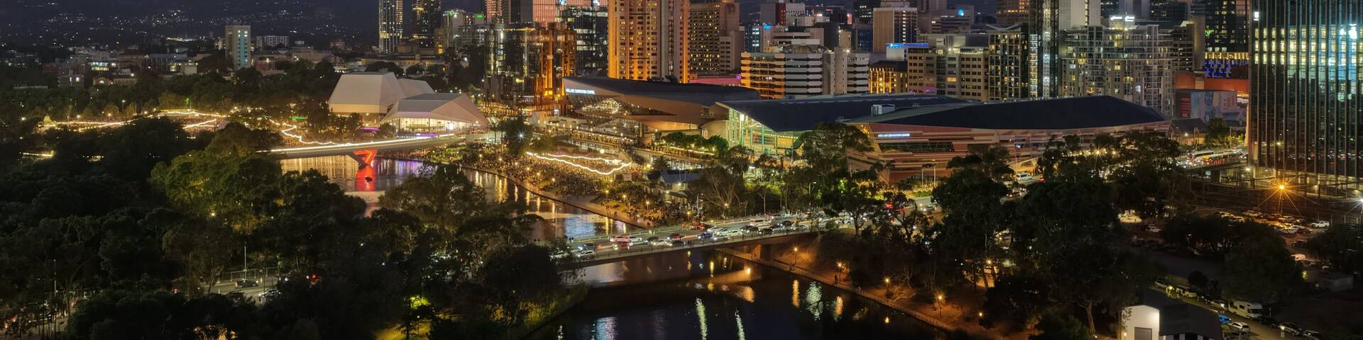 Adelaide City, South Australia – Aerial Drone View of Night Skyline, Riverbank Precinct, Festival Lights, Urban Cityscape Along River Torrens