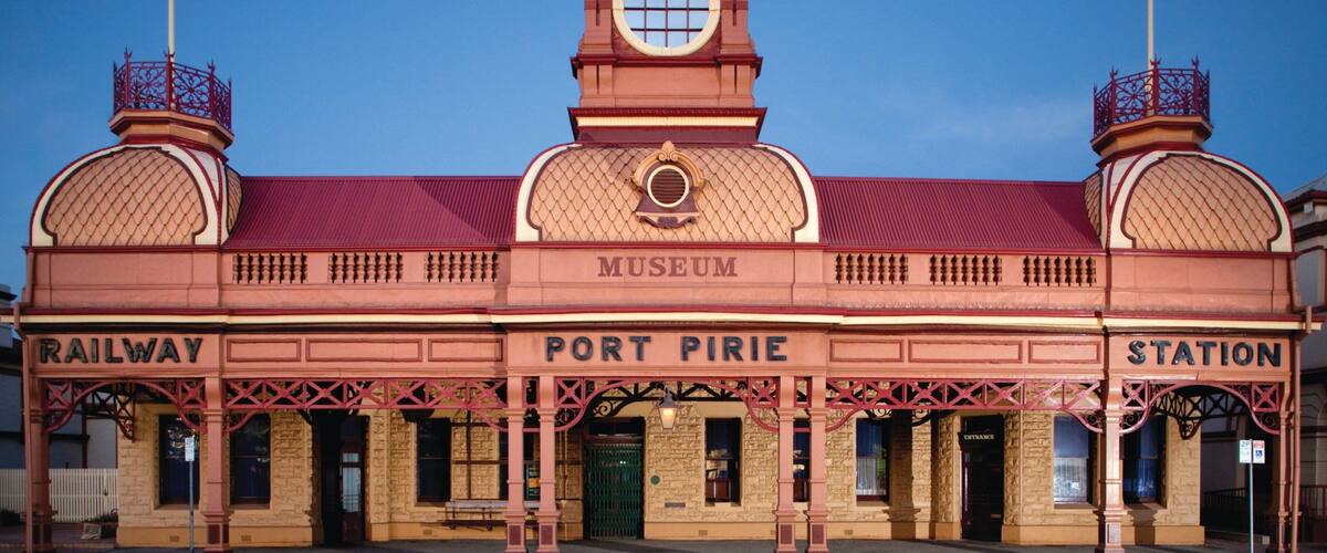 A historic railway station with a clock tower, labeled 'Port Pirie Museum Station'.