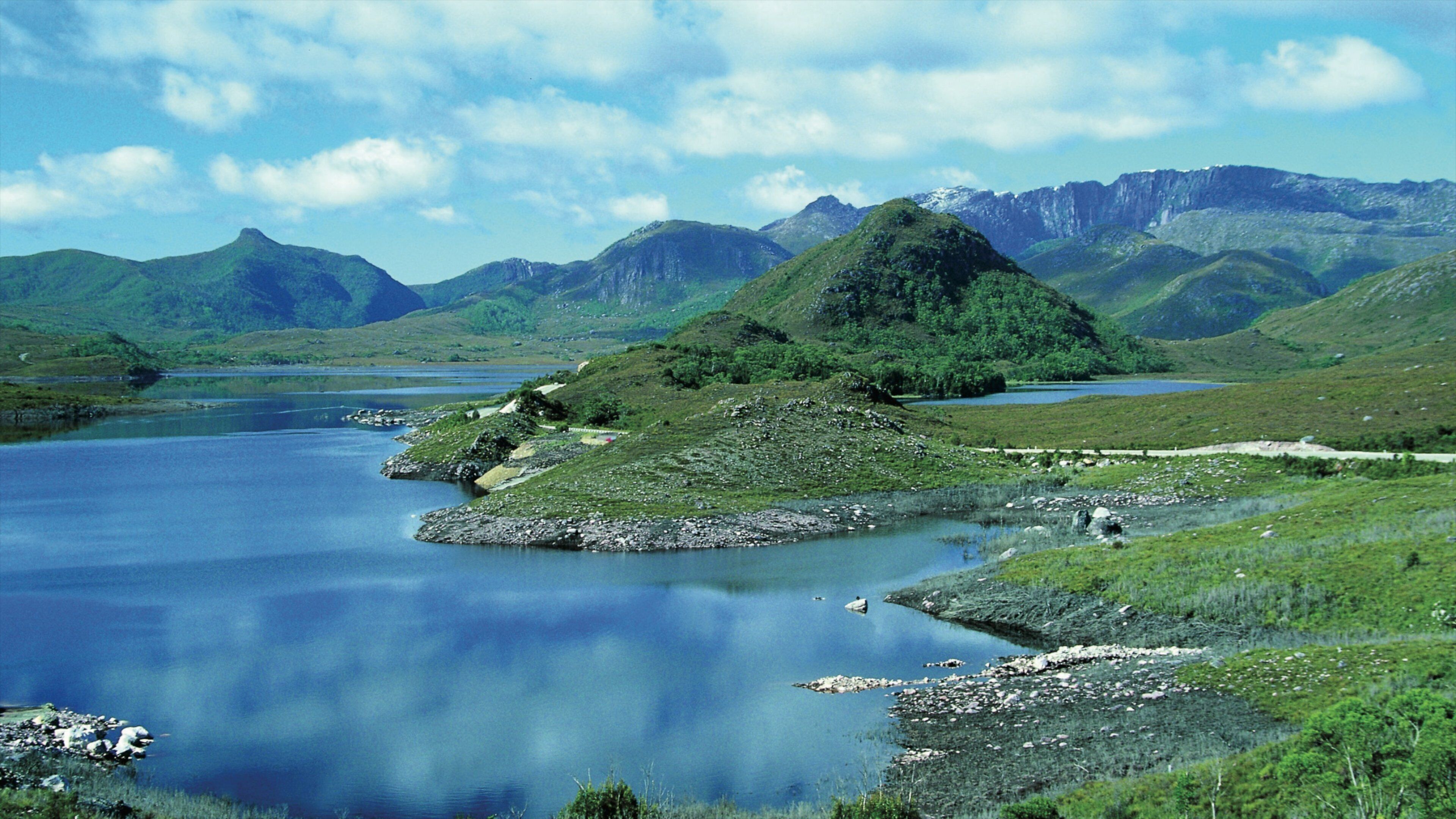 Zeehan showing mountains and a lake or waterhole