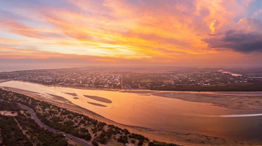 Colorful sunset over coastal river mouth