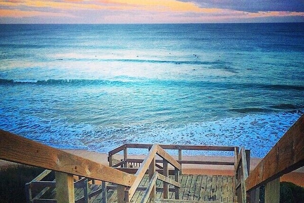 Thanks to my Internship and my hostdad! It was a very cold and busy winter day (summer for european) but we found time after work for a short trip to the beach. This view and the surfers definitely made my day.