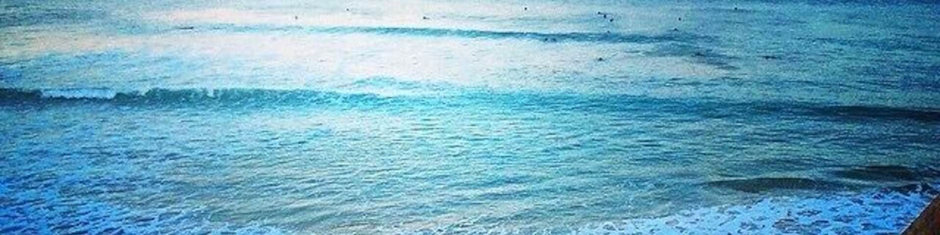 Thanks to my Internship and my hostdad! It was a very cold and busy winter day (summer for european) but we found time after work for a short trip to the beach. This view and the surfers definitely made my day.