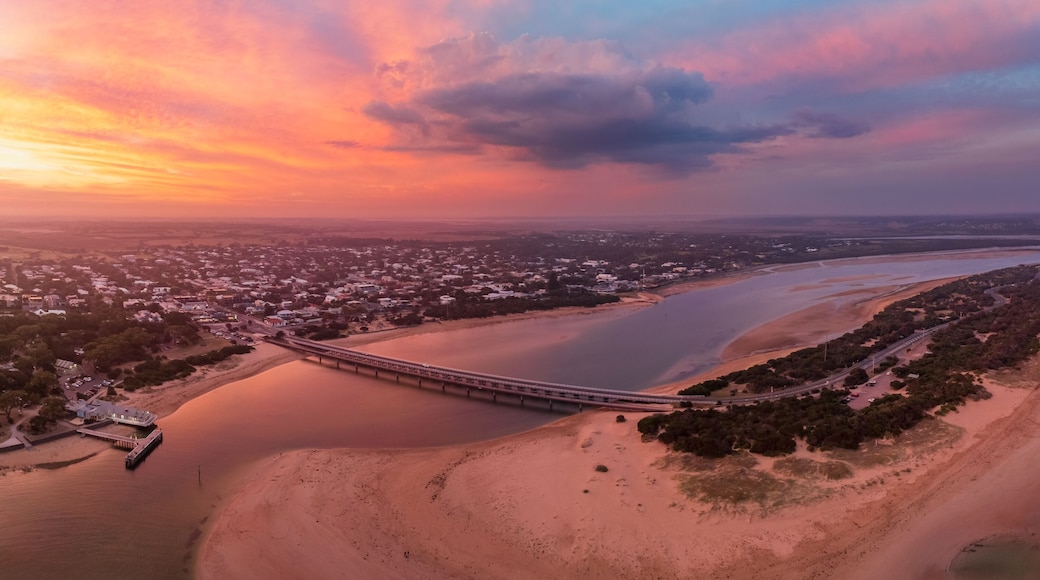 Colorful sunset over coastal river mouth