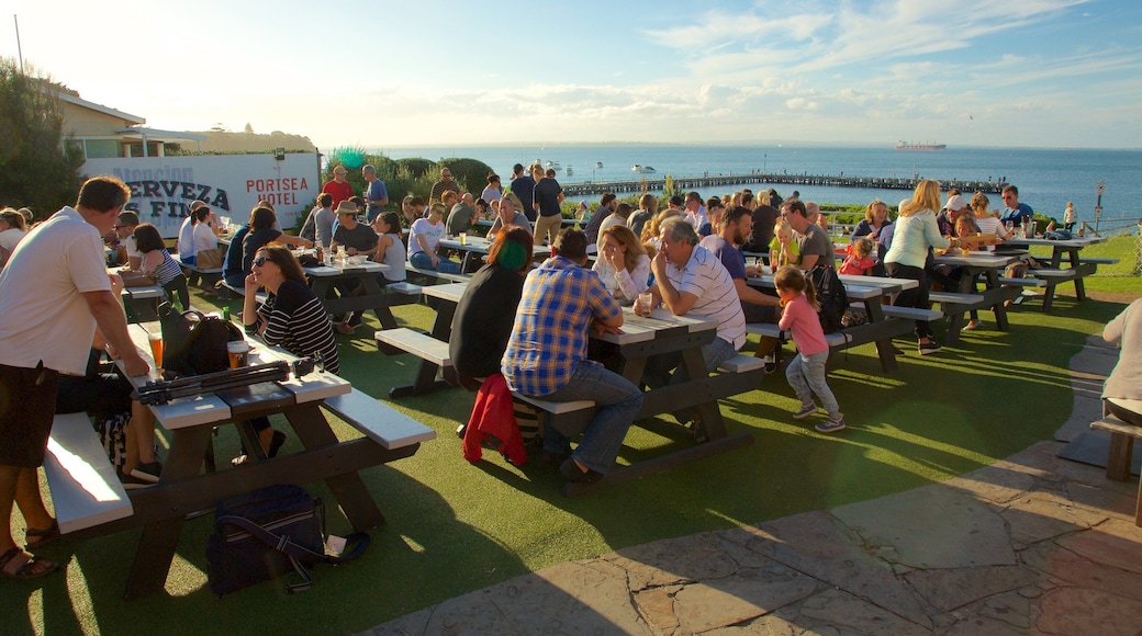 Portsea which includes outdoor eating as well as a large group of people