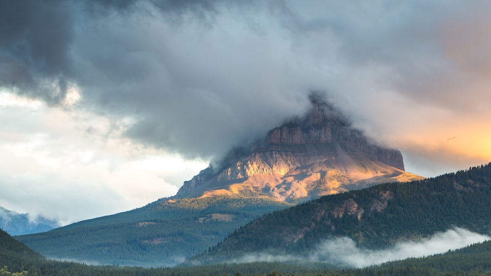 Scenic view of clouds over Crowsnest Mountain