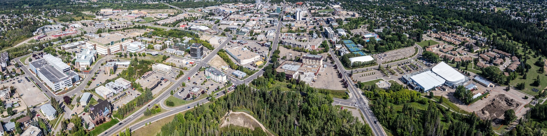 panoramic aerial landscape view of the Downtown area in Red Deer City, Alberta, Canada with streets and infrastructure. The City is located at Red Deer River between Edmonton and Calgary