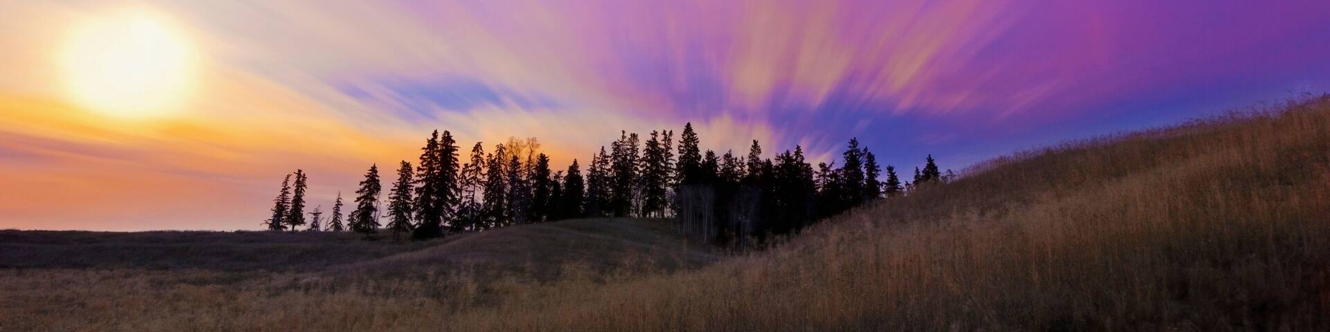 Streaks Through The Clouds At Sunset; Parkland County, Alberta, Canada