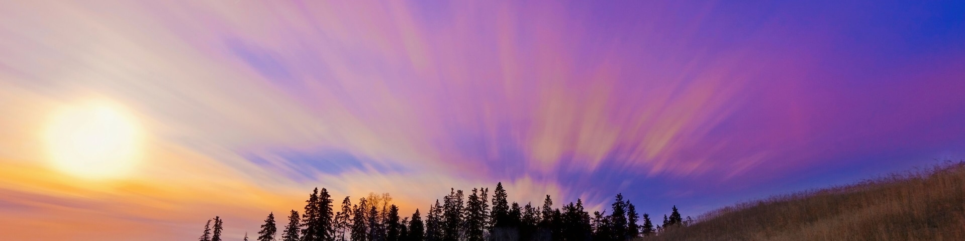 Streaks Through The Clouds At Sunset; Parkland County, Alberta, Canada
