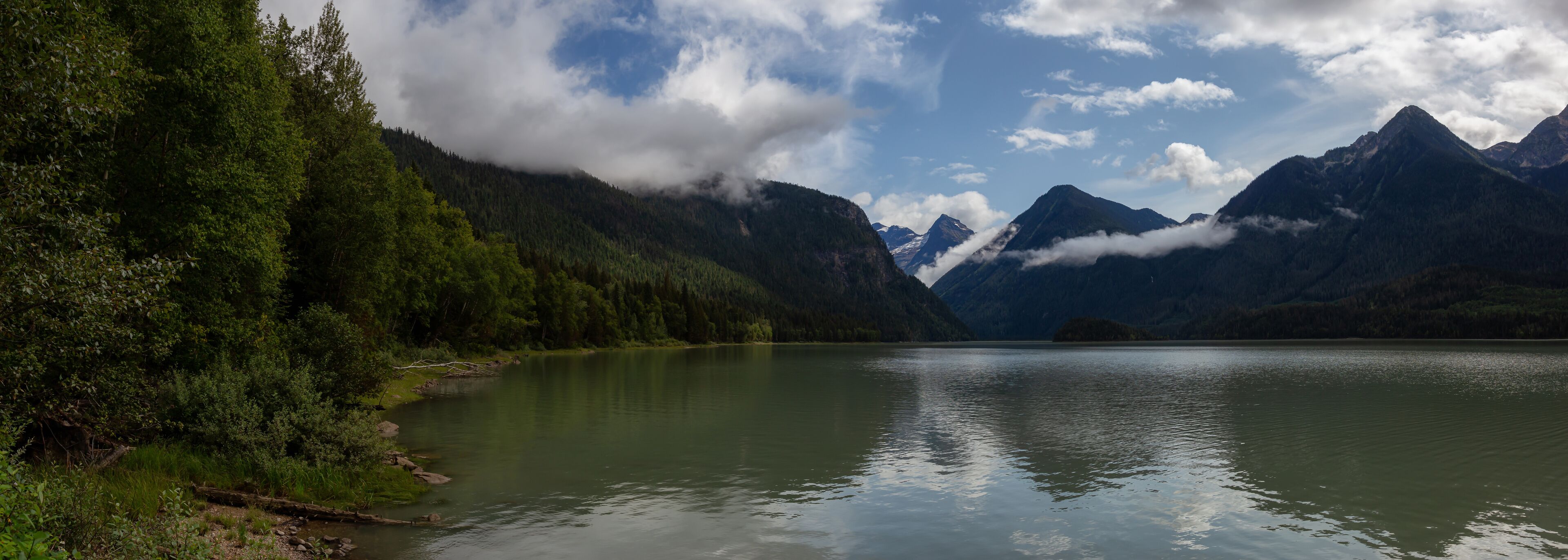 Beautiful Panoramic View of Mud Lake with Mountains in the background. Taken in Blue River, North of Kamloops, British Columbia, Canada.
