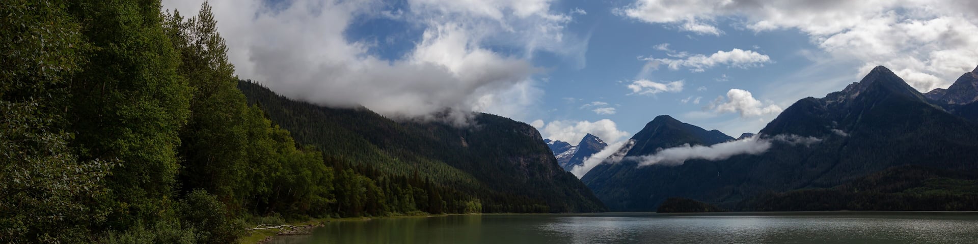 Beautiful Panoramic View of Mud Lake with Mountains in the background. Taken in Blue River, North of Kamloops, British Columbia, Canada.