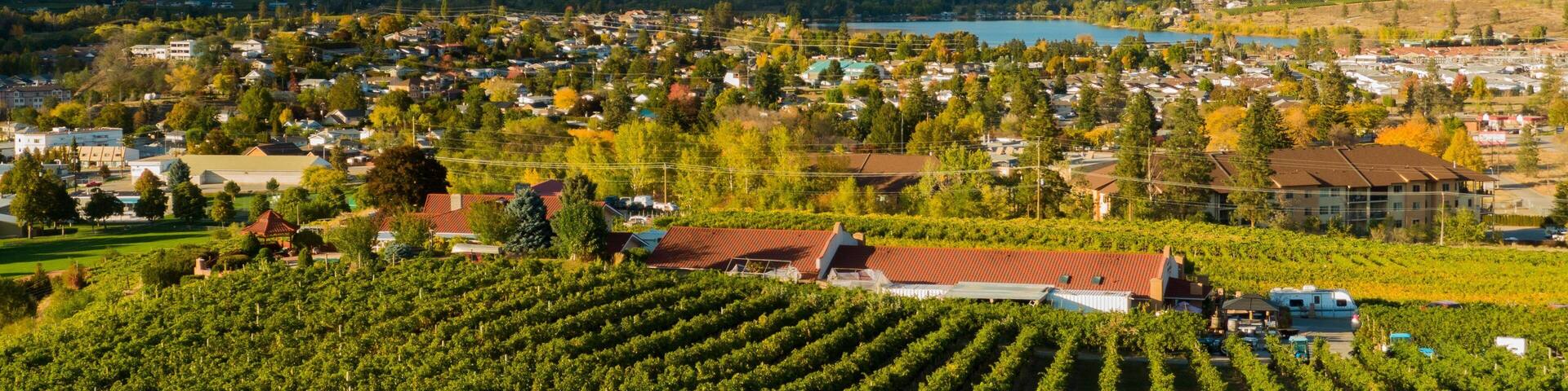 Oliver which includes a small town or village, farmland and landscape views