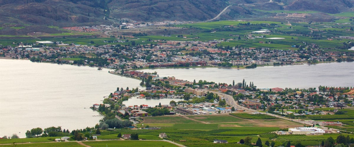 A town by a lake surrounded by hills.