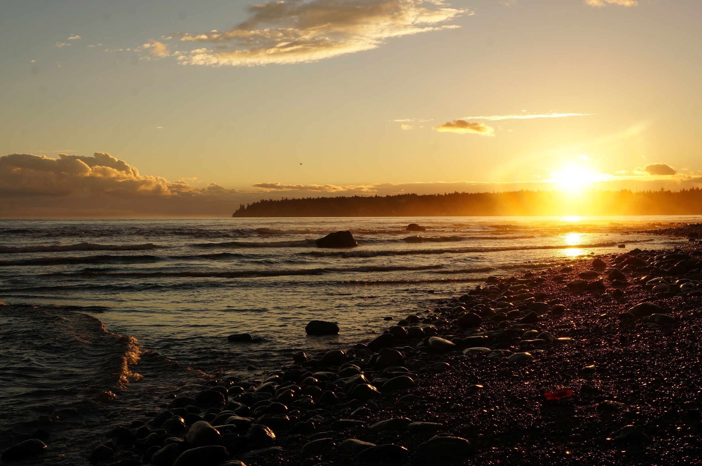 The quiet town of Qualicum Beach is one of those perfect places to watch the sunset, Sunshine reflecting on the water and wet rocks. The last bit of heat warming your face...sigh... #GoldenHour #AquaTrove