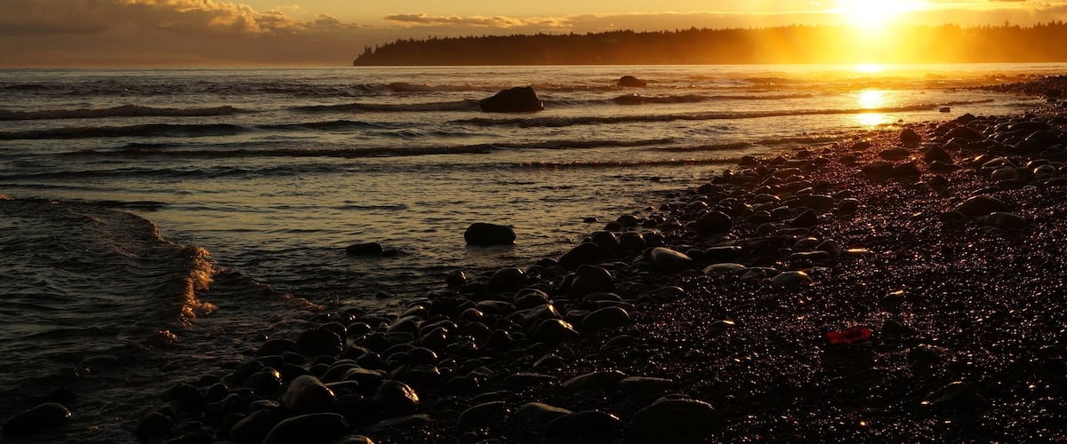 The quiet town of Qualicum Beach is one of those perfect places to watch the sunset, Sunshine reflecting on the water and wet rocks. The last bit of heat warming your face...sigh... #GoldenHour #AquaTrove