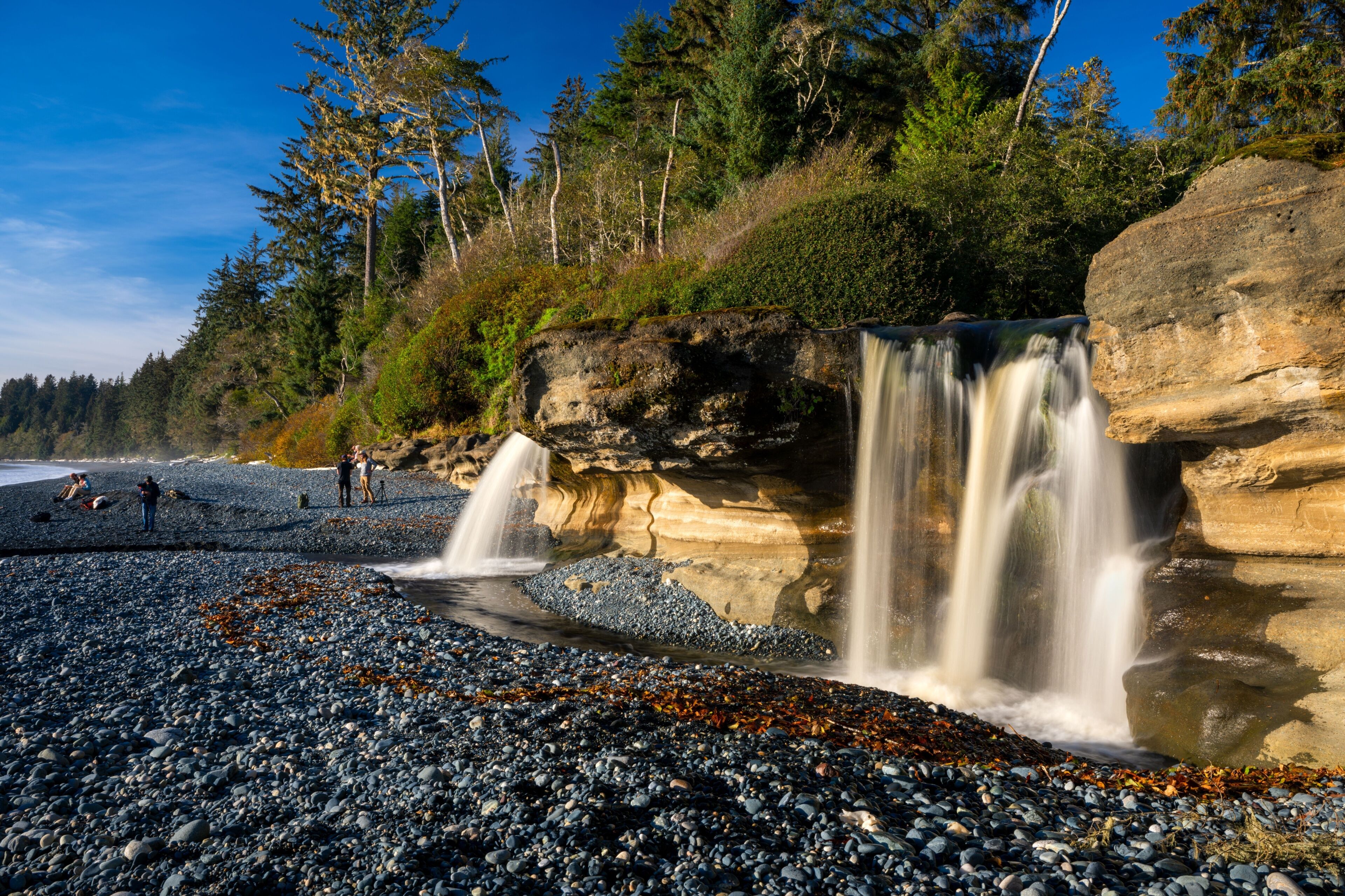 Scenic view of Sandcut Beach waterfalls near Sooke, British Columbia, Canada