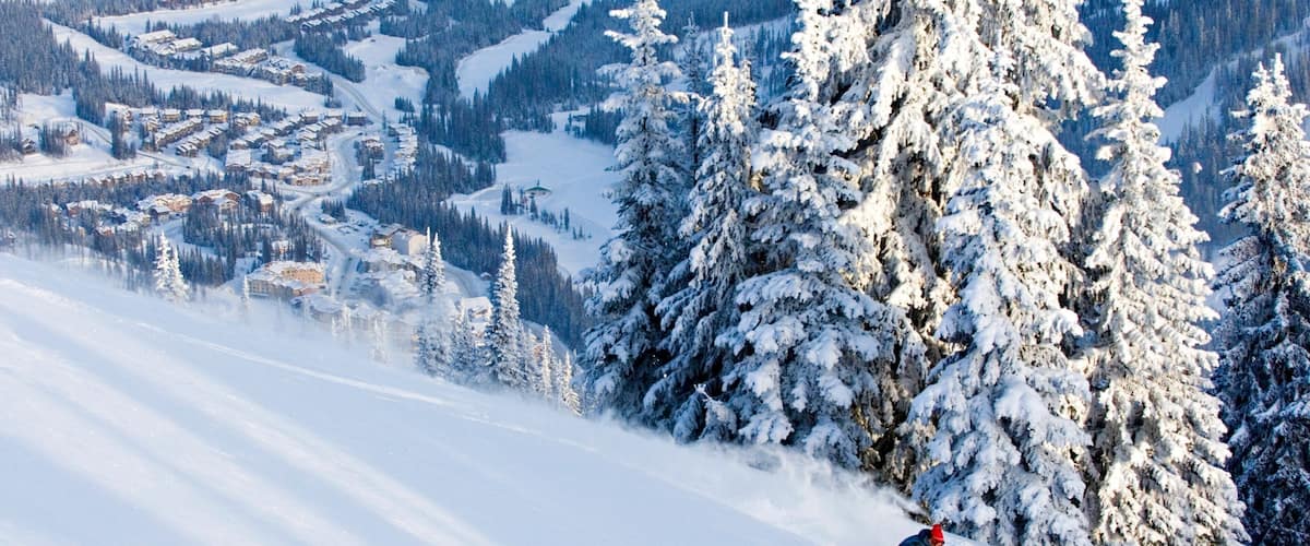 Sun Peaks which includes snow skiing, snow and a small town or village