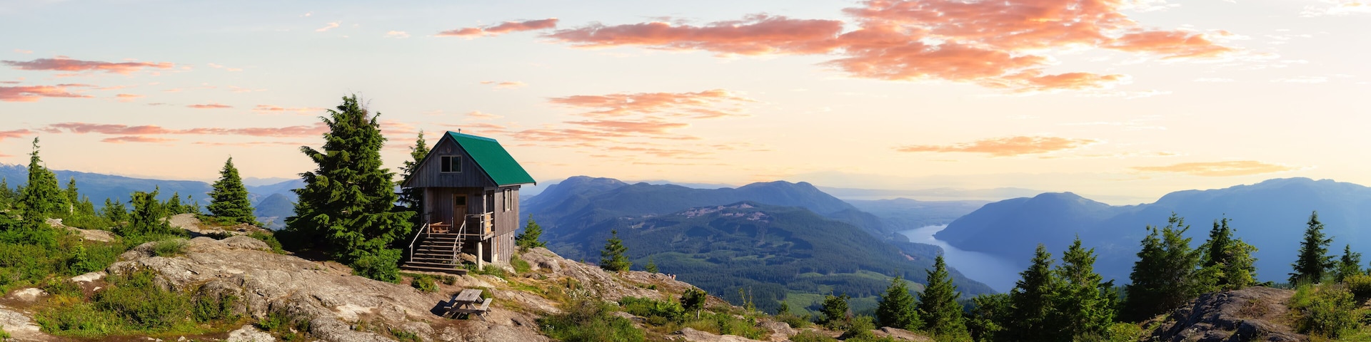 View of Tin Hat Cabin on top of a mountain. Dramatic Colorful Sunset Art Render. Located near Powell River, Sunshine Coast, British Columbia, Canada.