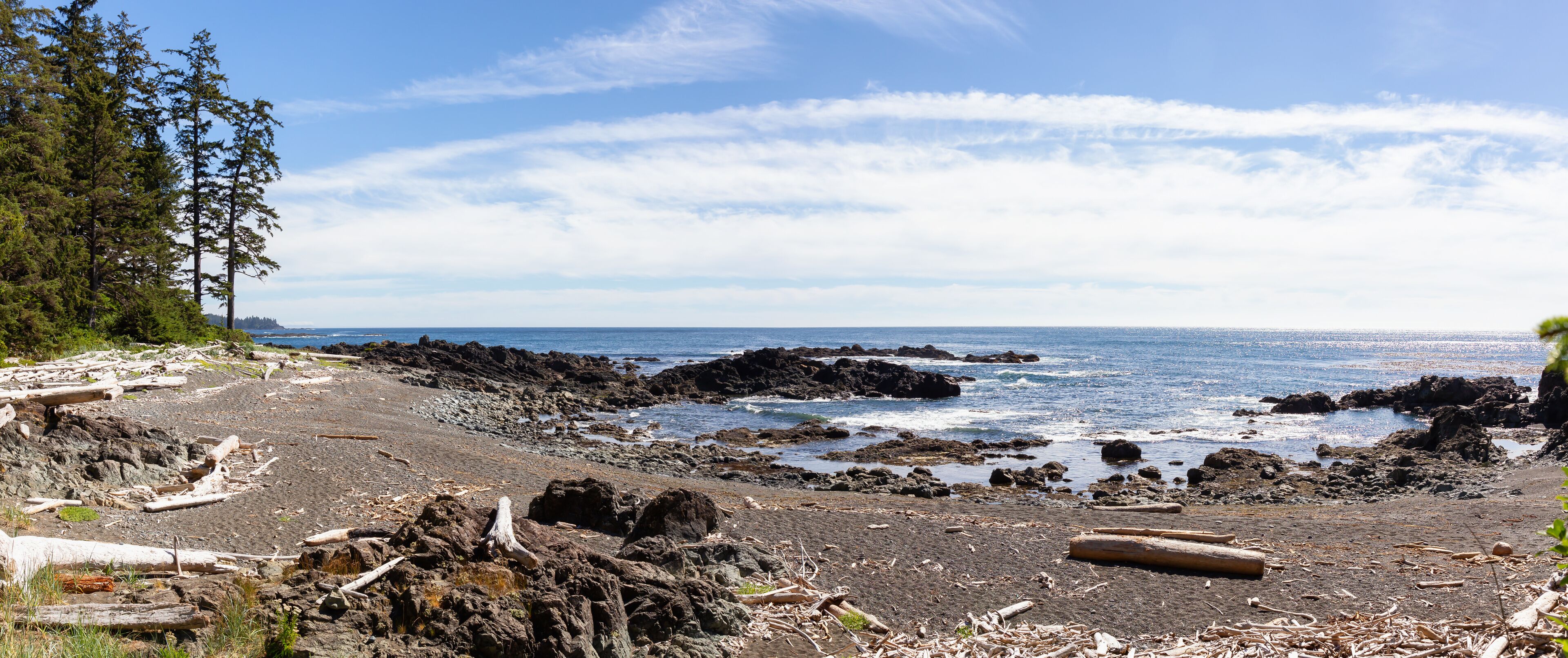 Rocky beach on the Pacific Ocean Coast during a sunny summer day. Taken in Palmerston Beach, Northern Vancouver Island, BC, Canada.