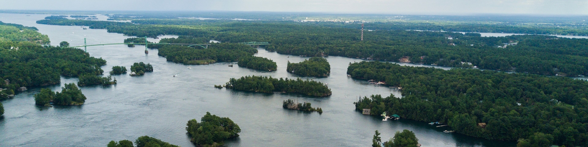An aerial view of a river with numerous small islands covered in dense greenery.