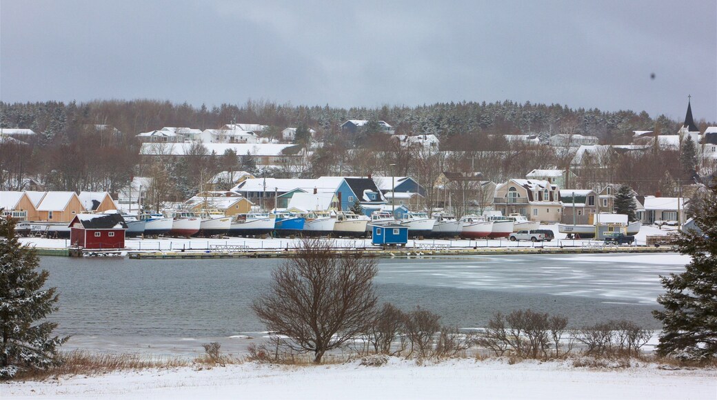 North Rustico featuring a lake or waterhole, snow and a small town or village
