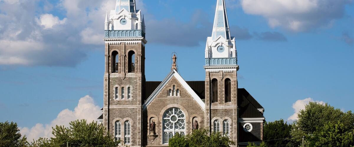 Church building with a bell tower and clock tower;Farnham quebec canada