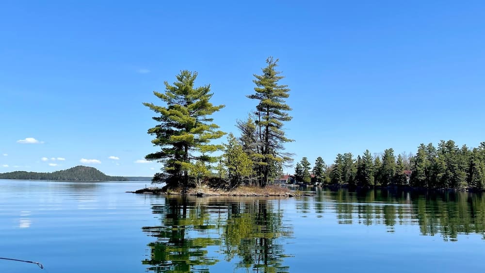 Beautiful small island, crystal clear water, in our beautiful 31 Mile Lake, Gracefield, Quebec, Canada. Photo taken while fishing on a beautiful sunny day.