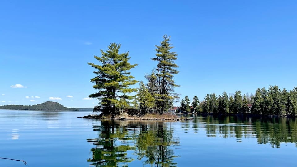 Beautiful small island, crystal clear water, in our beautiful 31 Mile Lake, Gracefield, Quebec, Canada. Photo taken while fishing on a beautiful sunny day.