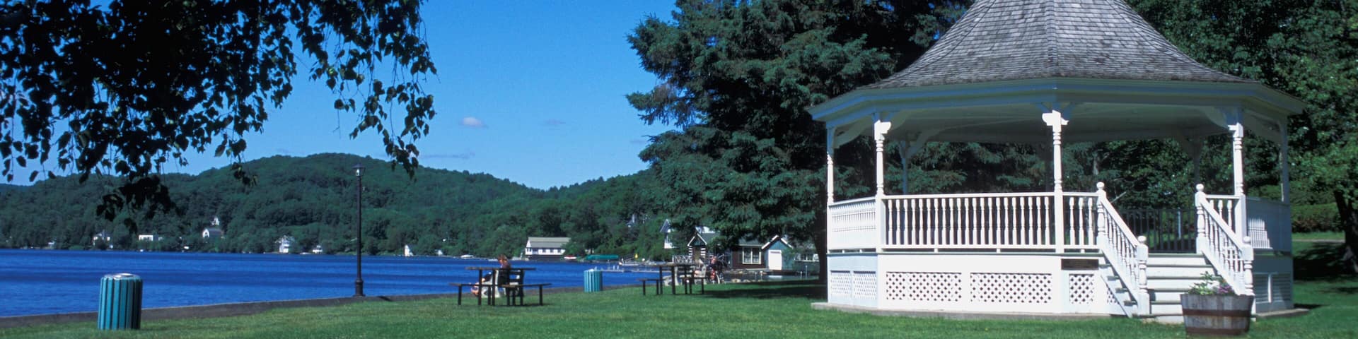 A Gazebo In A Park Near A Body Of Water