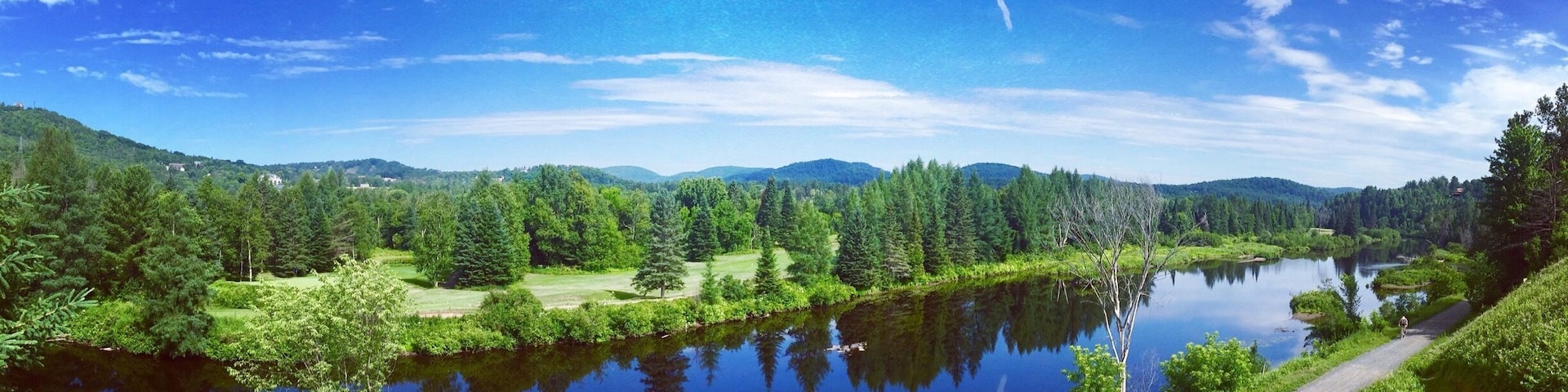 Biking the Train du Nord trail in Ste. Adele.
It runs for 200 kilometres (124 miles) between Saint-Jérôme and Mont-Laurier and is used for biking, cross-country skiing and hiking.
The Parc Linéaire Le P'tit Train du Nord is a multi-use recreational rail trail located in Quebec. It originally was a railway track operated by Canadian Pacific Railway, Inc., which reportedly operated it at a continuous financial loss ever since its construction in the 1890s, before dismantling it during the 1990s to make way for today's beautiful recreational trail—save for the portion between Montréal and Saint-Jérôme which is still in service.
#Green