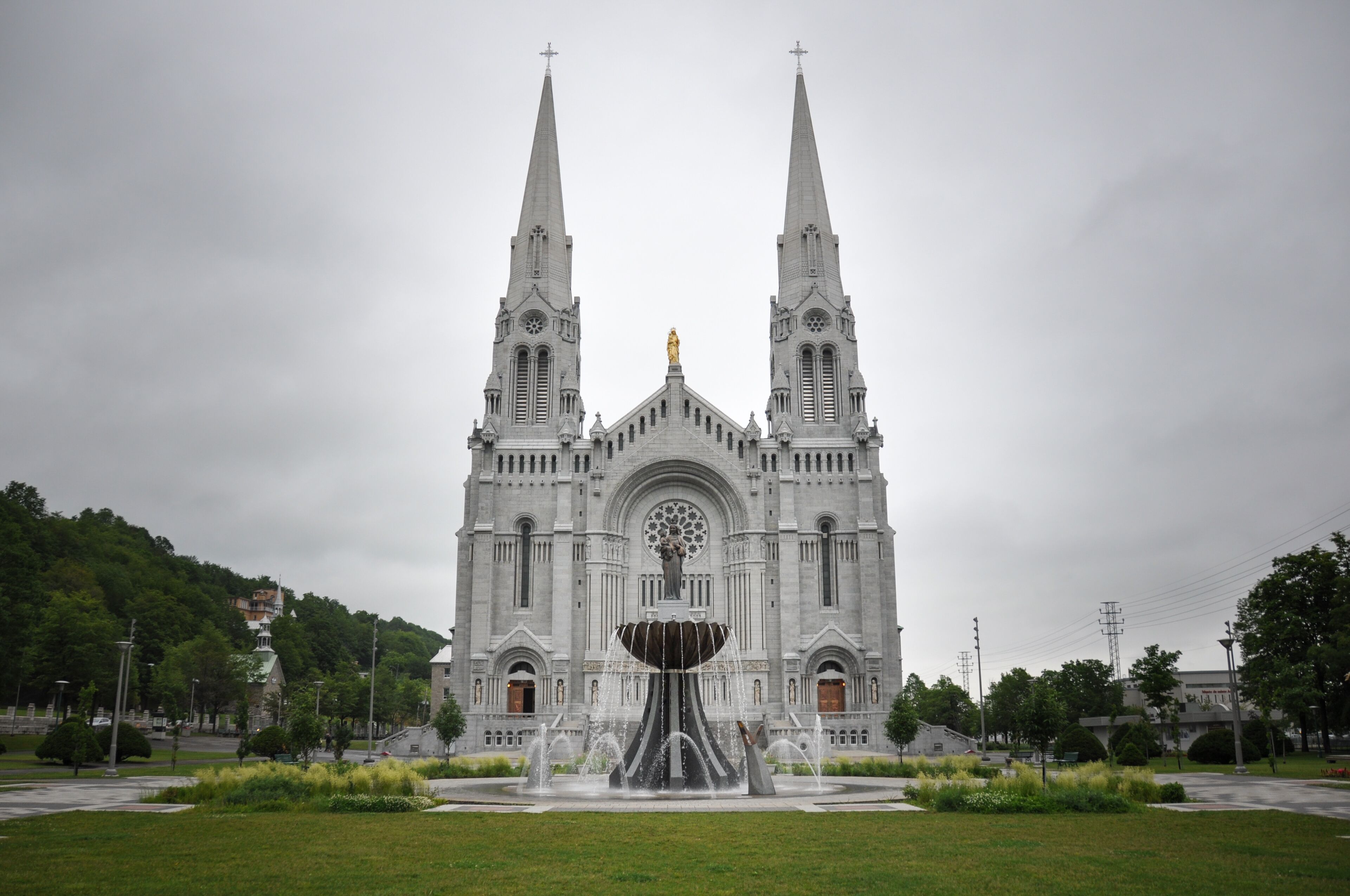 A large cathedral with twin spires and a central statue.