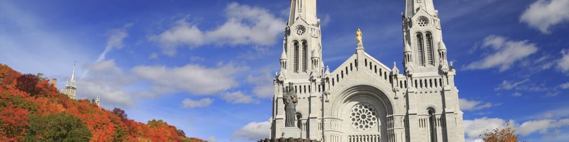 Basilica of Sainte-Anne-de-Beaupre with autumn colors on the background; Shutterstock ID 497910646; PO: Hcom Destination Content neighborhoods; Client: Hotels.com; Other: Hcom brand budge