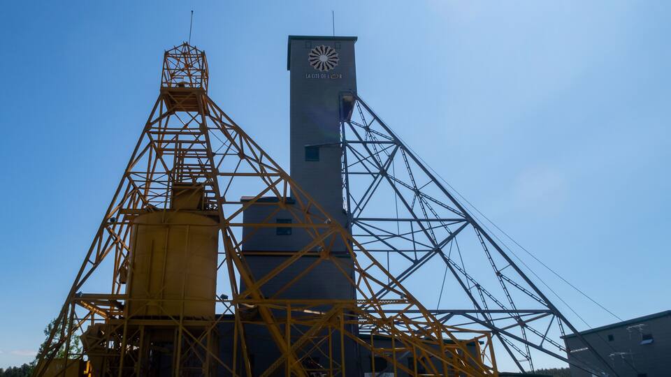 A large industrial structure with a prominent tower and a complex framework.