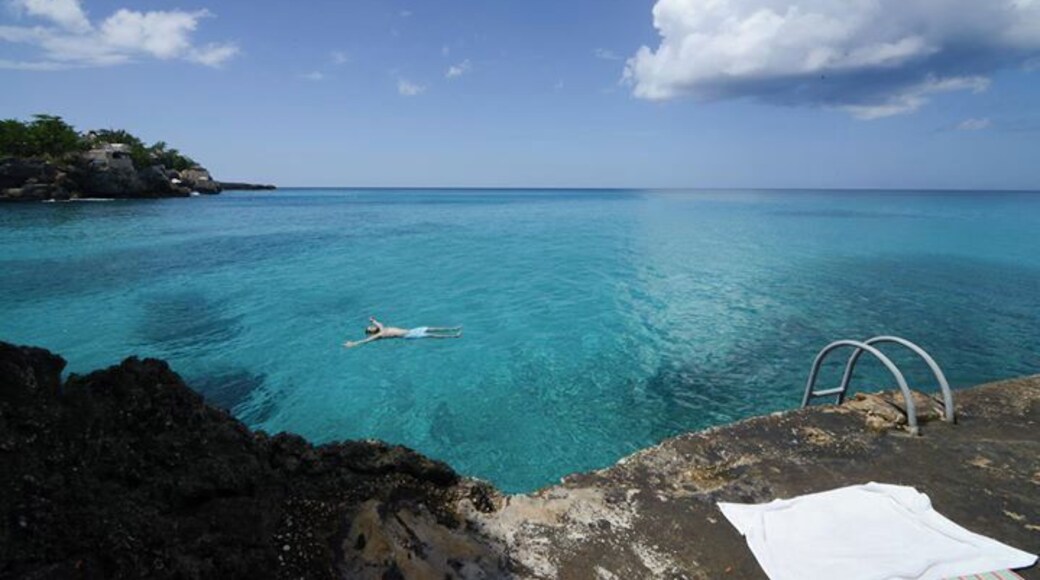 We prefer to stay cliffside instead of the beach in Negril. A lot quieter and the views go on forever.