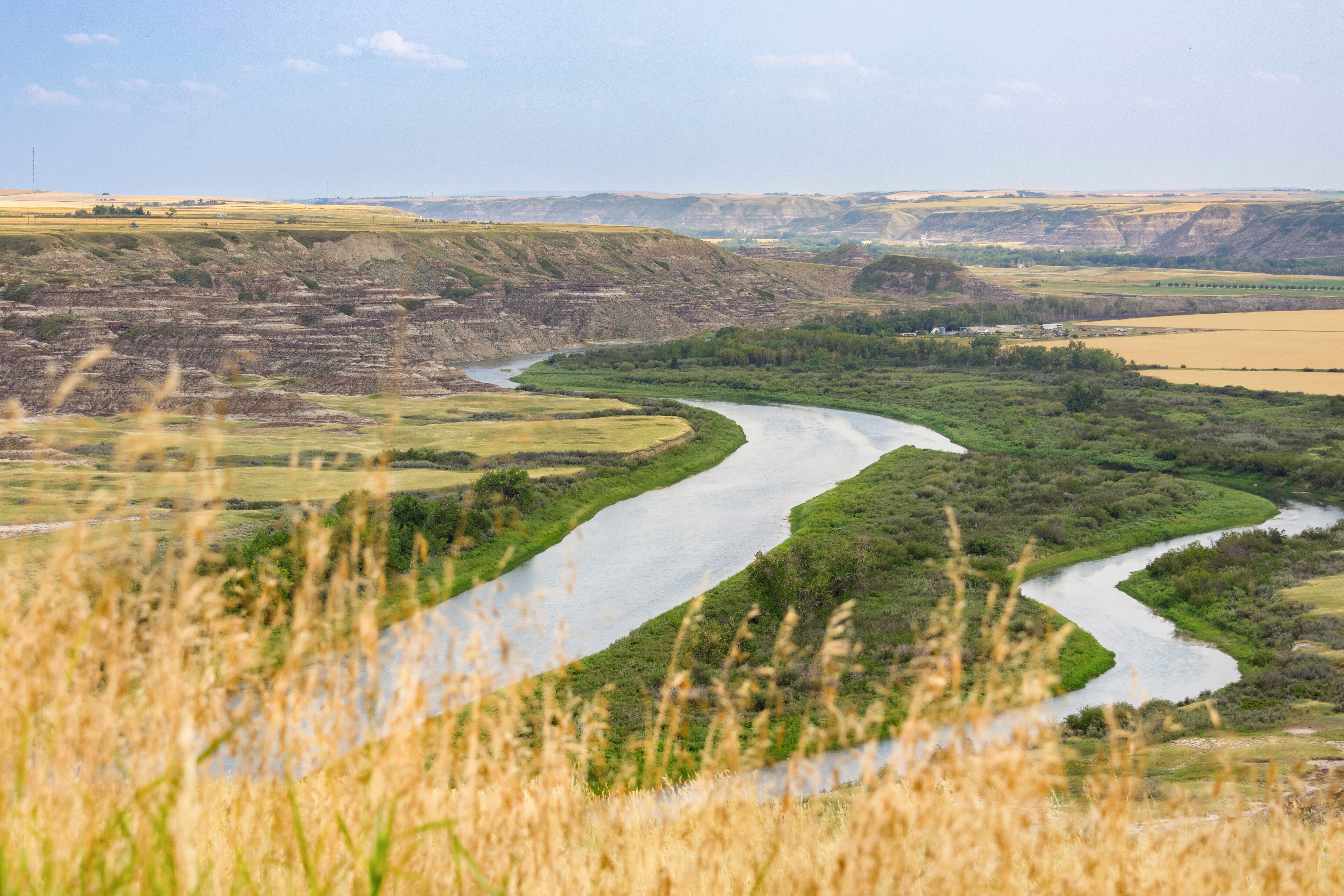 View to the river in the valley among badlands from the top of the hill.