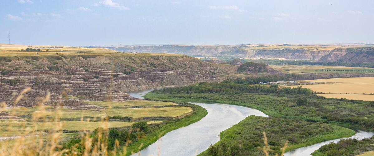 View to the river in the valley among badlands from the top of the hill.