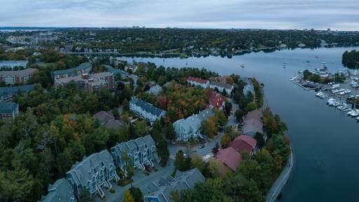 Aerial panoramic view of Melville Cove in the Modern City during a cloudy sunrise. Taken in Armdale, Halifax, Nova Scotia, Canada.