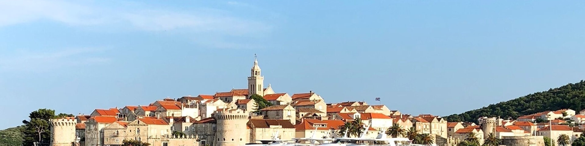 Korčula is a Croatian island in the Adriatic Sea. It lies just off the Dalmatian coast. Its 15,522 inhabitants make it the second most populous Adriatic island after Krk and the most populous Croatian island not connected to the mainland by a bridge. The population are almost entirely ethnic Croats.