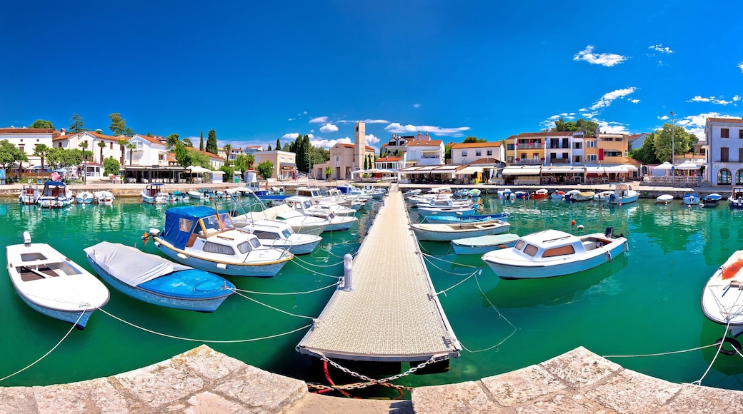 Krk. Town of Malinska harbor and turquoise waterfront panoramic view