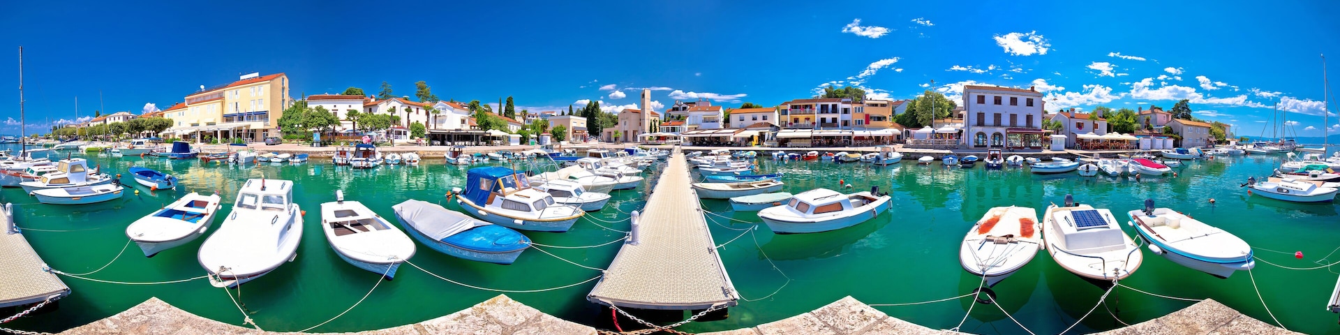 Krk. Town of Malinska harbor and turquoise waterfront panoramic view