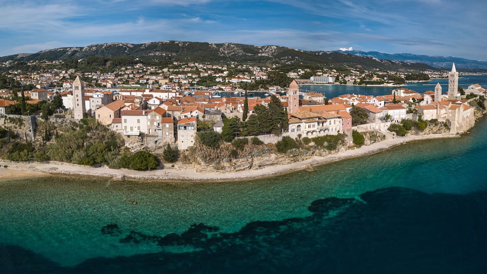 Aerial panorama picture of Rab city on the Rab Island, Croatia. Scenic view of Rab city surrounded by sea.