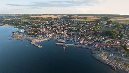 Panoramic Aerial View of Allinge Coastal Town on Bornholm Island with Rocky Shoreline and Colorful Seaside Buildings